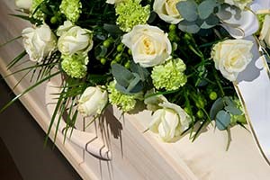 boquet of flowers on coffin